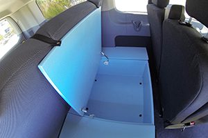 the back seat of a car with a blue seat.